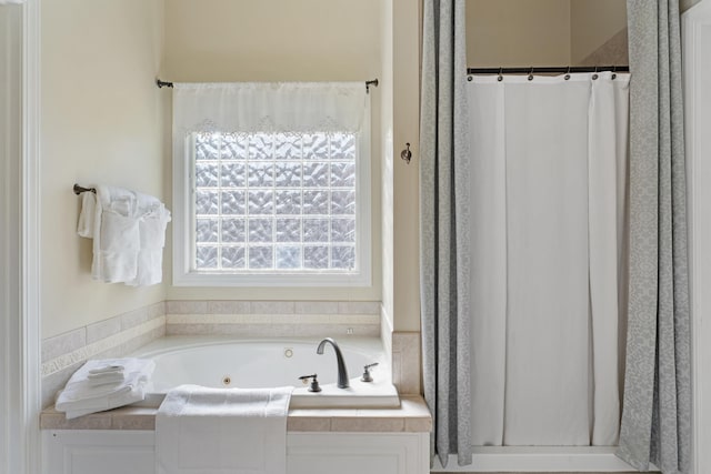 full bathroom with a shower with shower curtain and a tub with jets