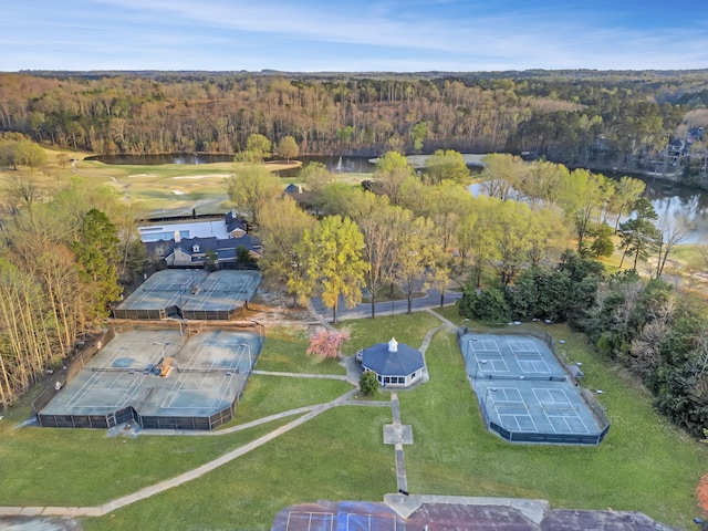 birds eye view of property with a forest view and a water view