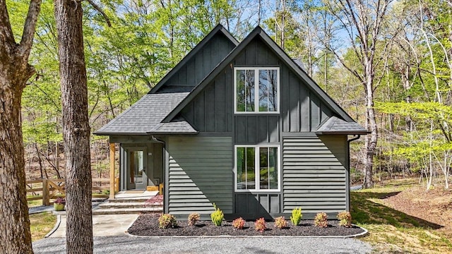 view of front of property with board and batten siding and a shingled roof