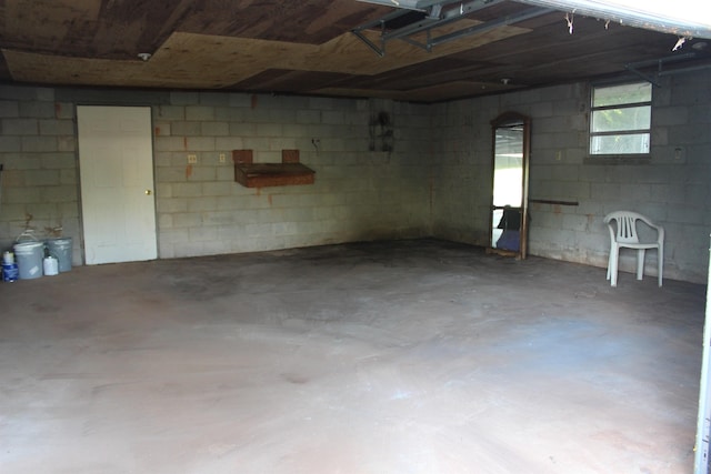garage with concrete block wall