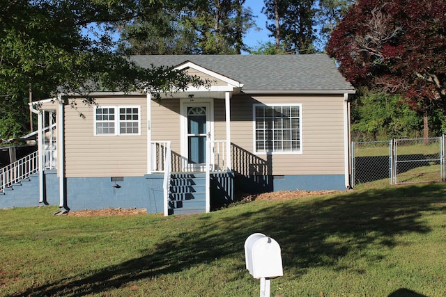 bungalow-style home featuring crawl space, a front yard, and fence