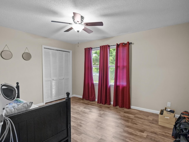 228 Anita, Spartanburg, SC 29302 - bedroom with wood finished floors, a textured ceiling, a closet, ceiling fan, and baseboards