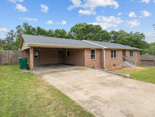 228 Anita, Spartanburg, SC 29302 - rear view of property featuring concrete driveway, fence, brick siding, a yard, and crawl space