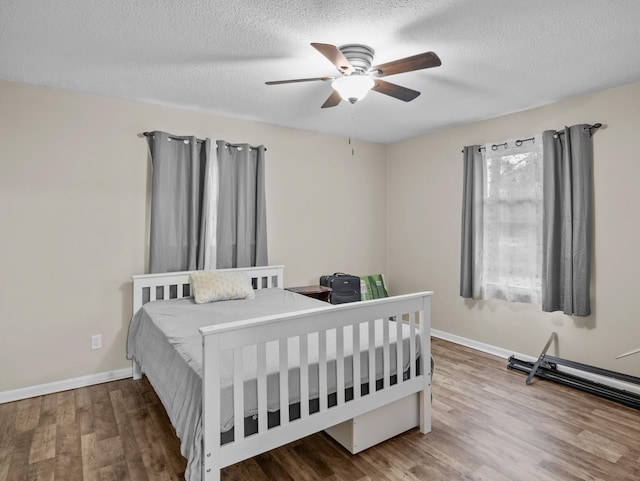 228 Anita, Spartanburg, SC 29302 - bedroom with wood finished floors, a textured ceiling, a ceiling fan, and baseboards