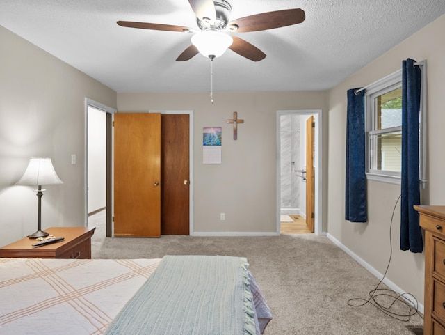 228 Anita, Spartanburg, SC 29302 - bedroom featuring a textured ceiling, ensuite bathroom, ceiling fan, light colored carpet, and baseboards