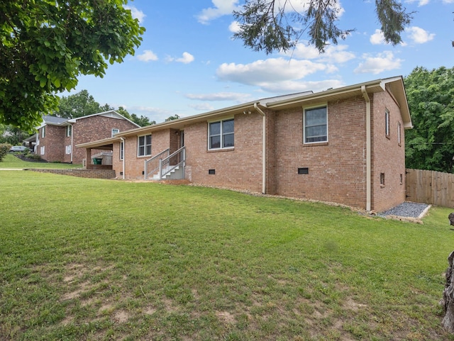 228 Anita, Spartanburg, SC 29302 - rear view of house featuring fence, crawl space, brick siding, and a yard