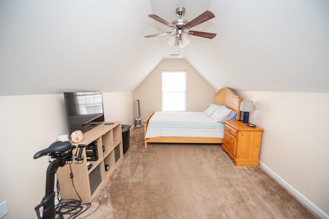 bedroom with light colored carpet, vaulted ceiling, a ceiling fan, and baseboards