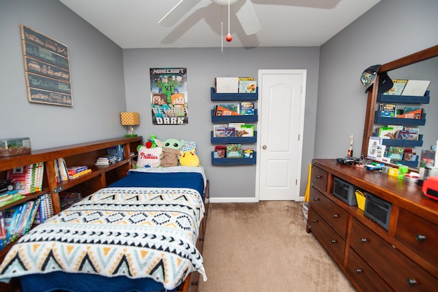 bedroom featuring baseboards and light colored carpet