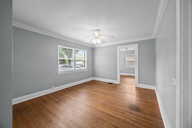 empty room with ceiling fan, baseboards, wood finished floors, and visible vents