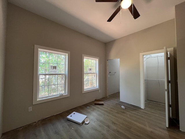 unfurnished bedroom featuring wood finished floors and a ceiling fan