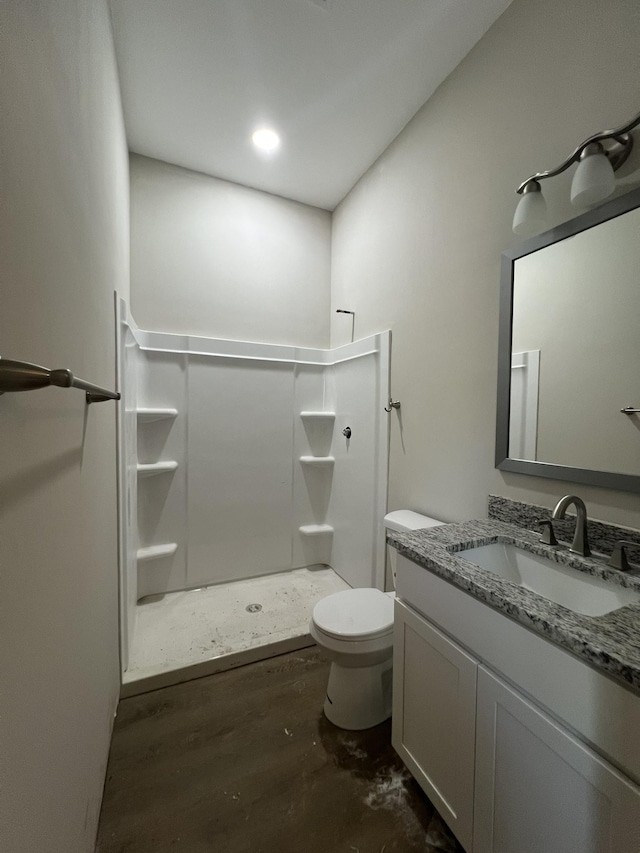 full bath featuring a shower stall, toilet, vanity, and wood finished floors