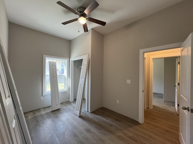 unfurnished bedroom featuring a ceiling fan and wood finished floors