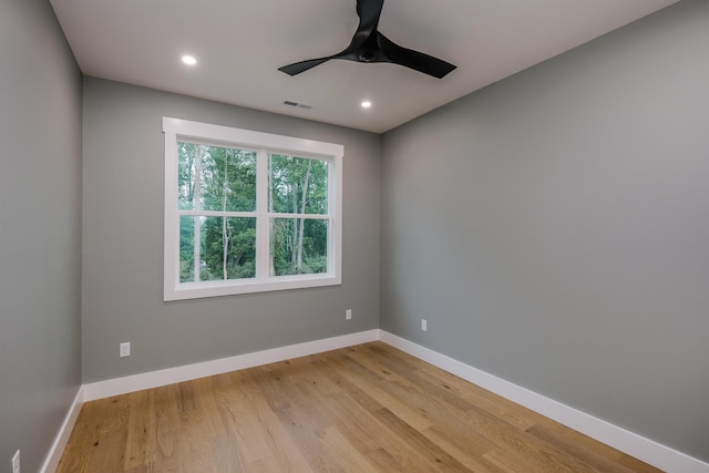 empty room featuring light wood-style flooring, baseboards, recessed lighting, and a ceiling fan