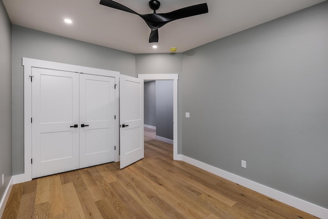 unfurnished bedroom featuring recessed lighting, ceiling fan, baseboards, and light wood-style flooring