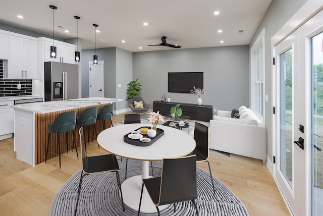 dining area featuring a ceiling fan, light wood-style floors, visible vents, and recessed lighting