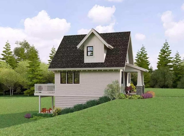 view of side of home featuring a deck, a yard, and roof with shingles