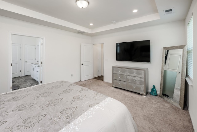 carpeted bedroom featuring visible vents, recessed lighting, and a tray ceiling