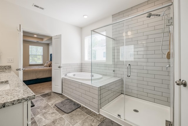 full bathroom featuring a shower stall, visible vents, ensuite bathroom, a garden tub, and vanity