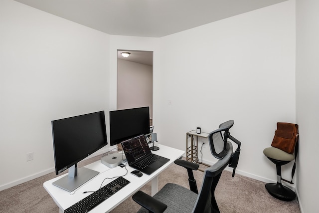 carpeted office space with baseboards