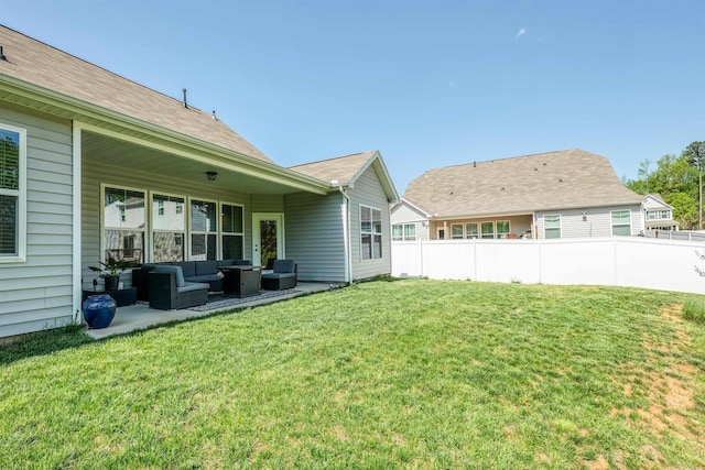 view of yard featuring outdoor lounge area, fence, and a patio area
