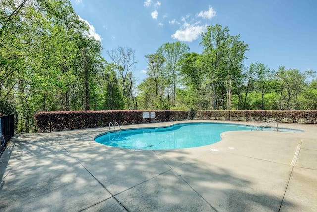 pool with a patio area