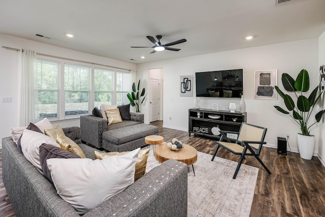 living room featuring visible vents, ceiling fan, baseboards, recessed lighting, and dark wood finished floors