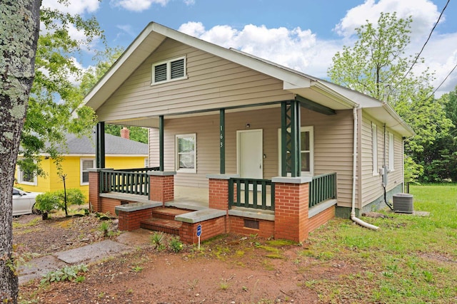 view of front facade with covered porch and central air condition unit