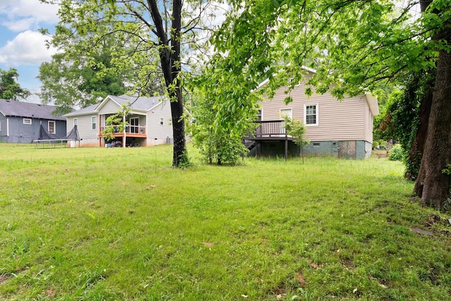 view of yard with a deck