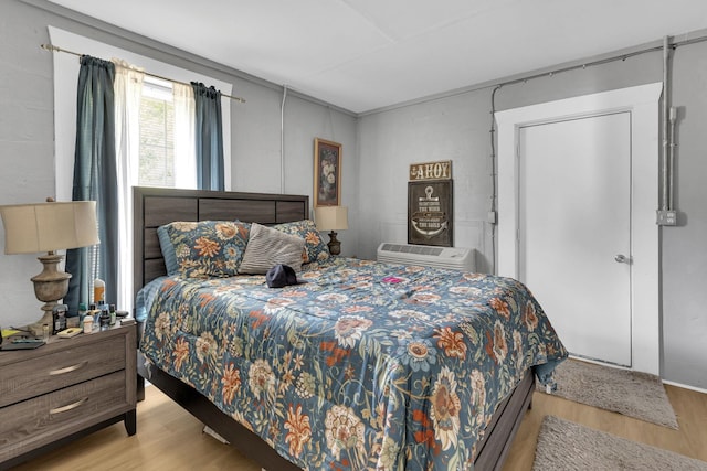 bedroom with wood finished floors