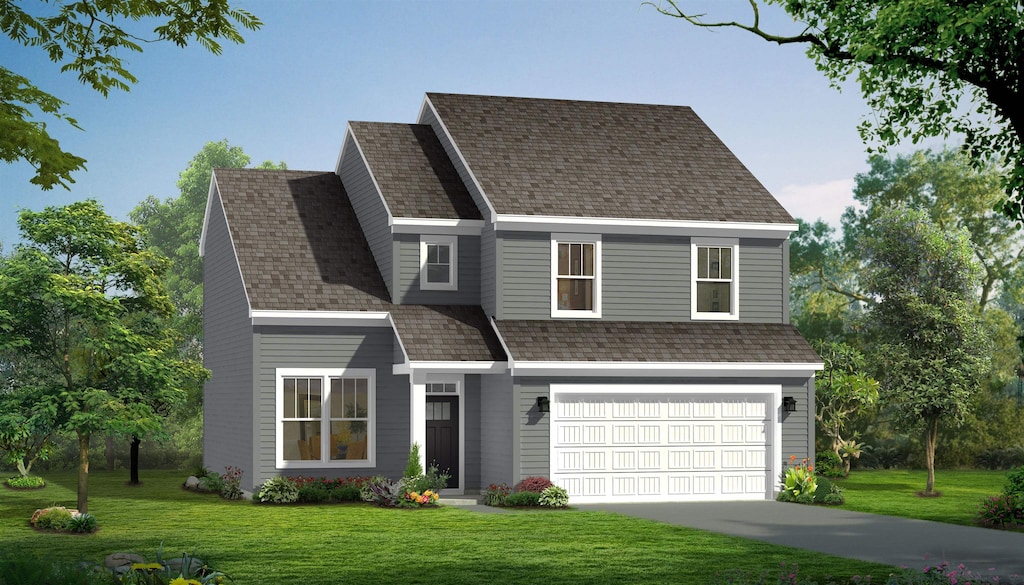 traditional-style house featuring a front lawn, concrete driveway, and an attached garage