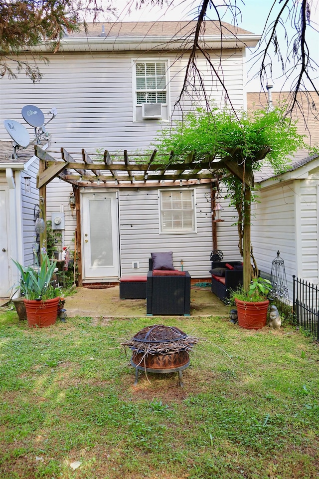 back of house with a pergola, a patio, a yard, and fence