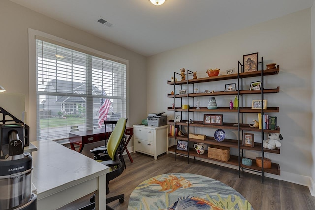 office featuring visible vents, wood finished floors, and baseboards