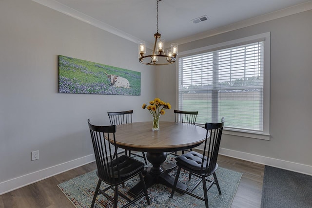 dining area with ornamental molding, visible vents, plenty of natural light, and a notable chandelier