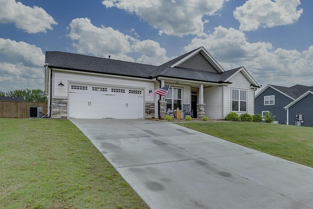 view of front of property featuring covered porch, driveway, stone siding, central AC, and an attached garage