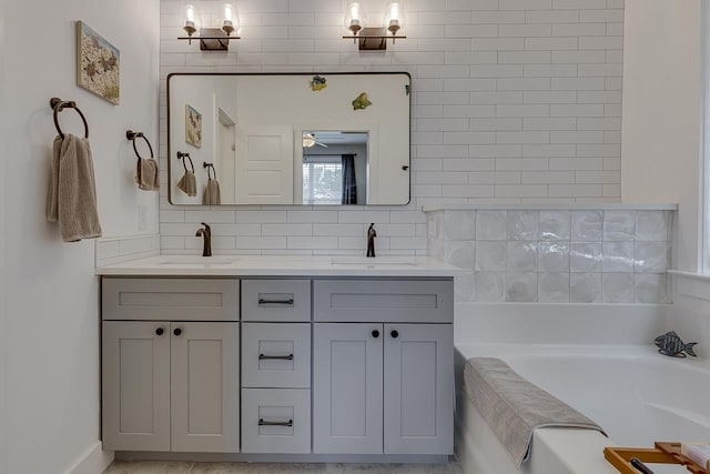 full bathroom with a garden tub, a sink, and backsplash