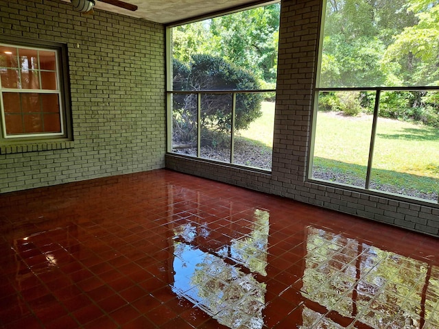 unfurnished sunroom with a healthy amount of sunlight