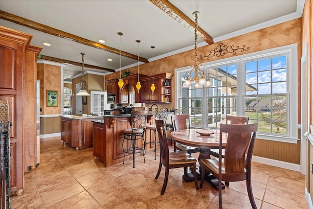 dining space with beam ceiling, an inviting chandelier, crown molding, and baseboards