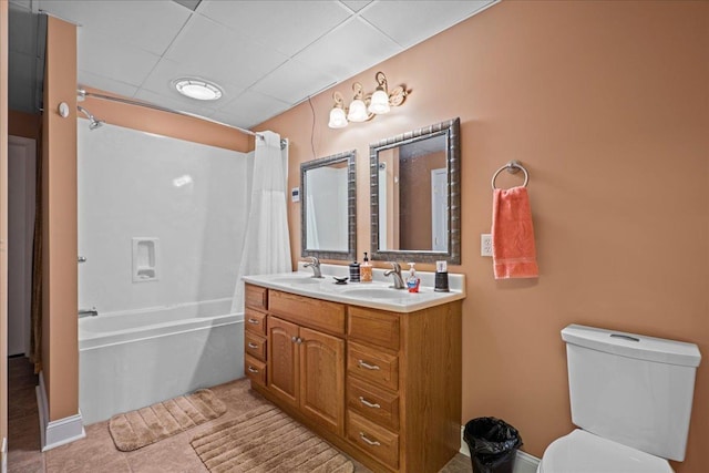 bathroom with toilet, double vanity, a sink, and shower / tub combo with curtain