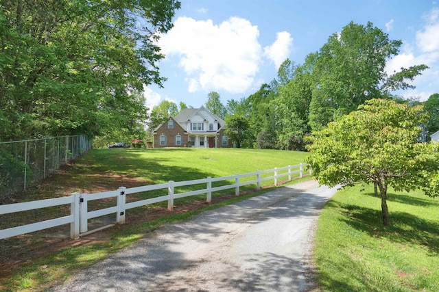 view of road featuring gravel driveway