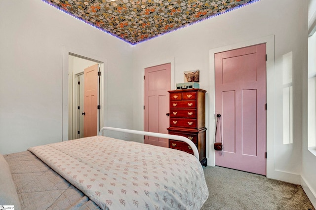 bedroom featuring light carpet