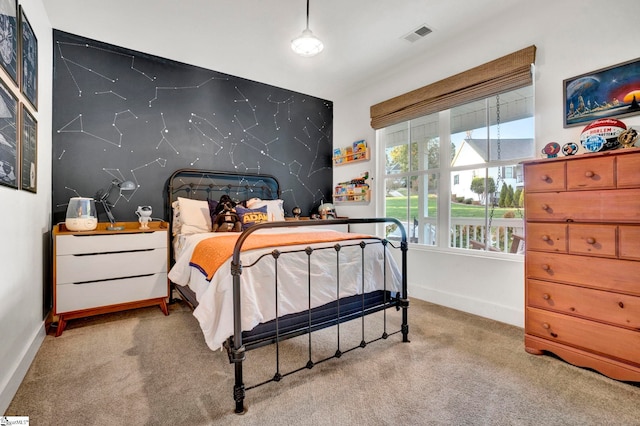 bedroom with visible vents, baseboards, and carpet floors