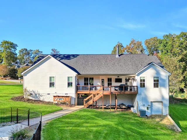 back of house with a deck, a yard, stairway, ceiling fan, and a garage