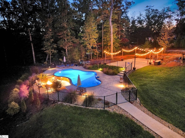 view of pool with a fenced in pool, a lawn, a patio, and fence