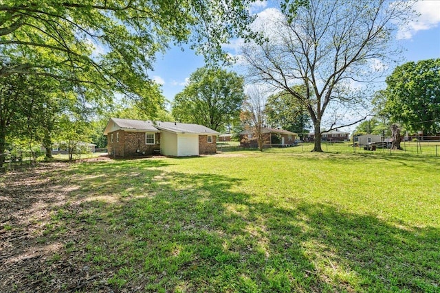 view of yard with fence