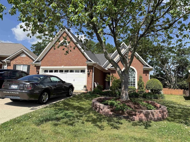 view of front facade featuring brick siding, fence, a garage, driveway, and a front lawn
