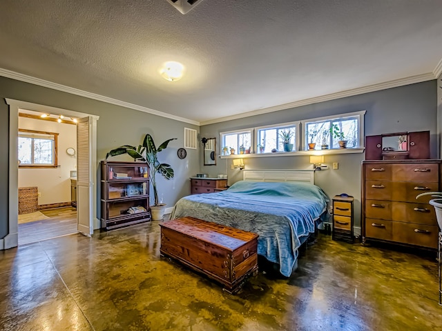 bedroom featuring ensuite bath, crown molding, baseboards, a textured ceiling, and finished concrete flooring