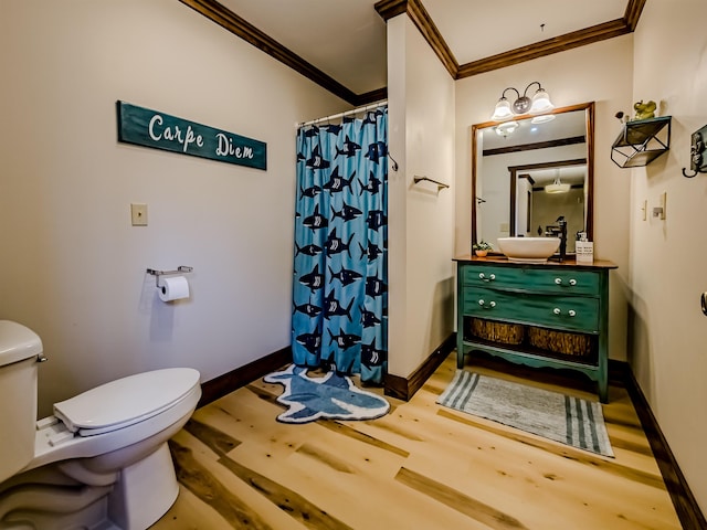 full bathroom with ornamental molding, toilet, wood finished floors, and a shower with shower curtain