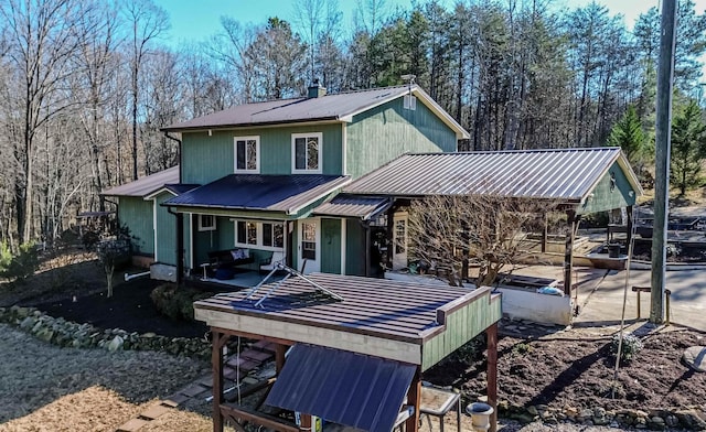 back of property with metal roof