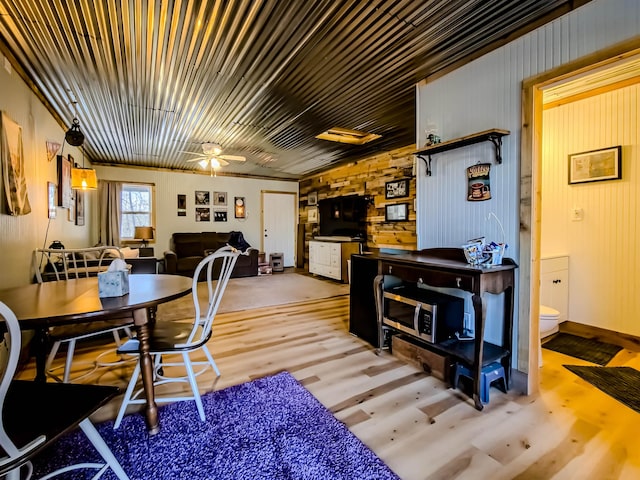 dining room featuring a ceiling fan and light wood-style flooring