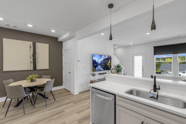 173 Dalmatian, Spartanburg, SC 29307 - kitchen featuring a sink, light wood-style floors, visible vents, light countertops, and stainless steel dishwasher